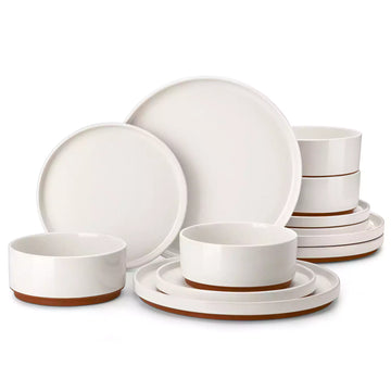 Set of white stoneware dinnerware with brown accents on a white background#color_white