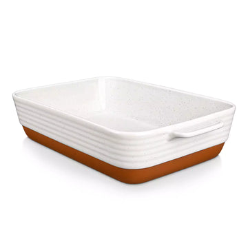Rectangular ceramic baking dish with brown bottom on a white background