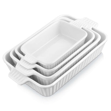 White porcelain rectangular bakeware set with fluted sides and ribbed handles, stacked for display.
