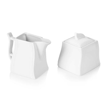 Flora Cream and Sugar Set: White porcelain creamer and lidded sugar bowl with ribbed detailing.