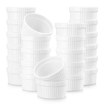 Set of 24 ivory white 2oz porcelain ramekins stacked and angled