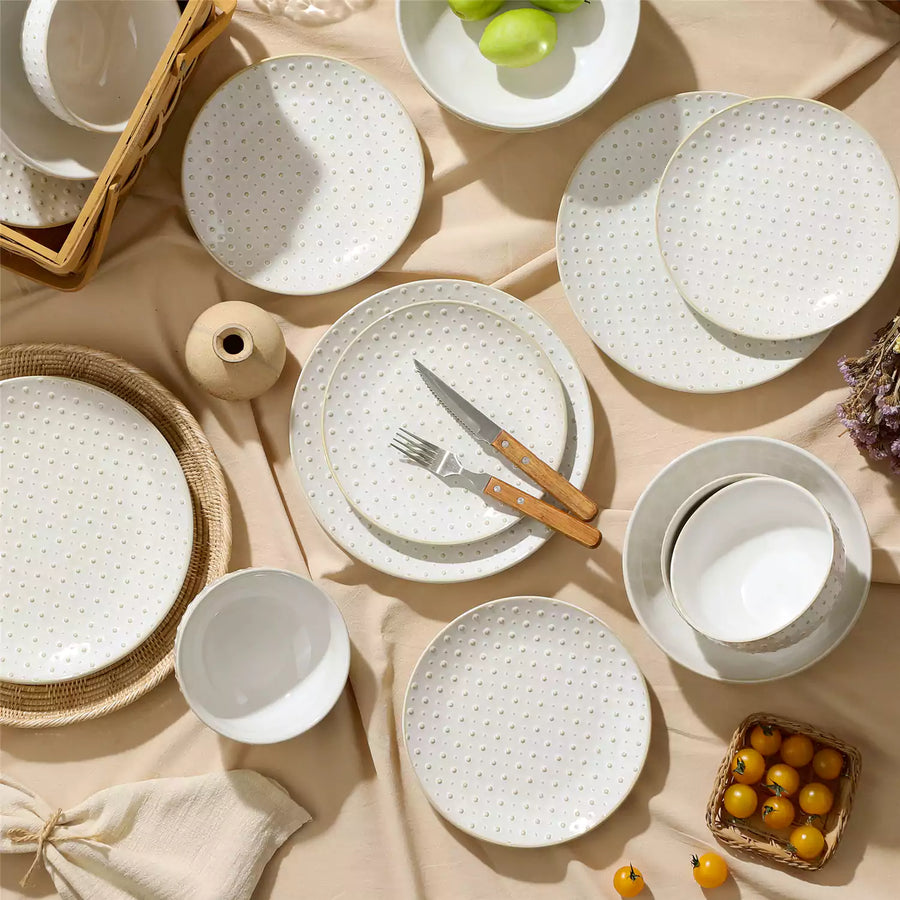 A modern porcelain dinnerware set displayed on a minimalist dining table, highlighting the blend of elegance, functionality, and durability for everyday use and special occasions.