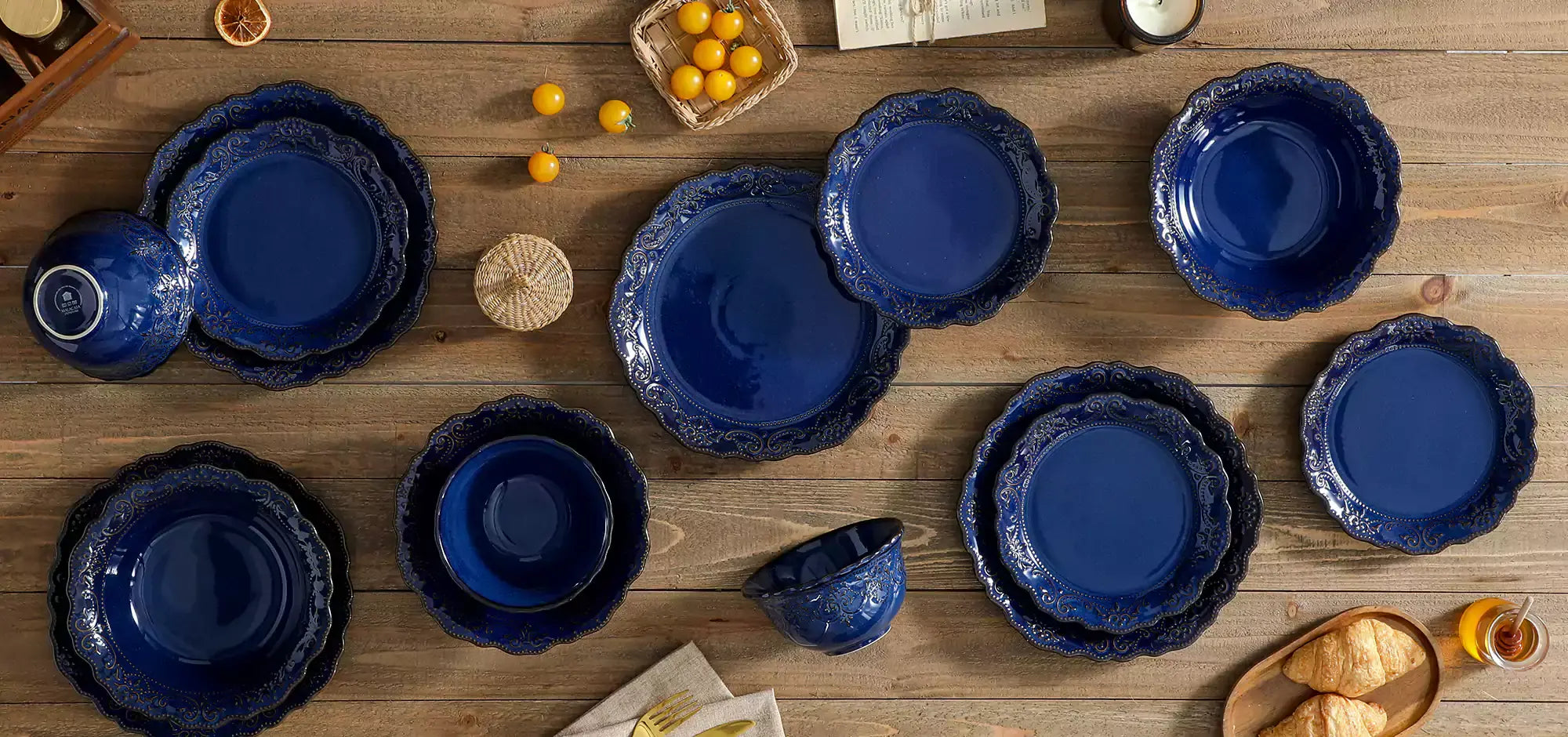 MALACASA Giselle blue dinnerware set with lace detailing, styled on a rustic table.